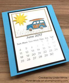 a blue and white calendar with an image of a van in the sun on it