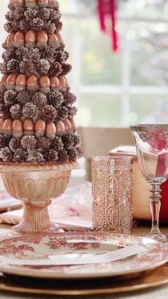 a christmas tree made out of pine cones on a table