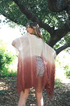 A lightweight knitted kimono with long fringe and a distressed back for an edgy, boho look. #LoveMyLeto 100% Acrylic Imported Oversized Bohemian Fall Cover-up, One Size Fall Wrap Cover-up, Hippie Festival Cover-up For Fall, Oversized Bohemian Cover-up For Fall, Fall Festival Hippie Style Cover-up, Fall Festival Hippie Cover-up, Fall Festival Open Front Cover-up, Bohemian Open Knit Poncho For Beach, Bohemian Open Knit Beach Poncho