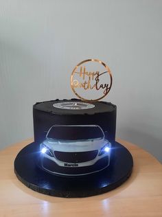 a birthday cake with a car on top