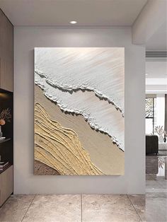 an abstract painting on the wall in a living room with white walls and tile flooring