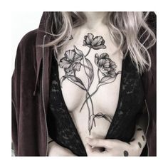 a woman's chest with flowers on it