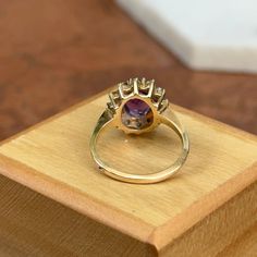 Estate/ Vintage 14KT Yellow Gold Diamond + Oval Genuine Purple Amethyst Ring Amethyst Measures: 10mm x 8mm Diamond Halo Style Band Cleaned and like new! Size 6.25 Can be sized by us (fee) or your local jeweler Weight: 4 grams Genuine Amethyst Oval Faceted Approx. 2.4 carat estimated amethyst Diamonds (12) SI Clarity, H/I color diamonds Stamped & Hallmarked Stamped 14K Oval Amethyst Ring Stamped 14k, Heirloom Style Purple Oval Amethyst Ring, Classic Oval Amethyst Ring With Halo Setting, Oval Purple Amethyst Ring With Center Stone, Heirloom Oval Purple Birthstone Ring, Heirloom Purple Oval Birthstone Ring, Oval Amethyst Ring In Halo Setting Yellow Gold, Hallmarked Oval Purple Ring, Oval Amethyst Ring In Yellow Gold With Halo Setting