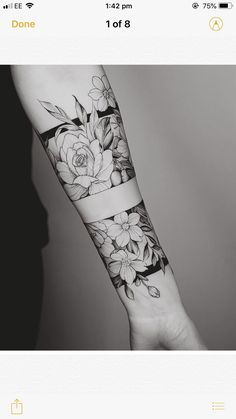 a person's arm with flowers on it