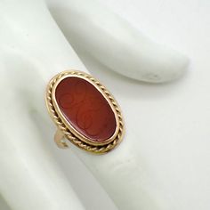 "Vintage 14 K (.585) yellow gold ring, decorated with oval form bezel-set Carnelian stone, featuring carved monogram \"XO\". This stately ring is a size 7 1/2, 1\" at the longest and weighs 8.1 grams. EA2463" Elegant Oval Ruby Ring With Intaglio, Stone Ring Design, Antique Jewelry Rings, Carnelian Ring, Gold Rings Fashion, Gold Ring Designs, Coral Ring, Carnelian Stone, Rings Fashion