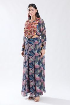 Blue crop top with thread and tassel embroidery. Paired with a flared pleated pant. - Aza Fashions Embroidered Maxi Length Summer Sets, Summer Festive Palazzo Set With Tassels, Summer Palazzo Set With Tassels, Summer Multicolor Tassel Sets, Tassel Embroidery, V Neck Crop Top, Pleated Pant, Embroidered Crop Tops, Pant Set For Women