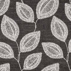 a black and white fabric with leaves on it