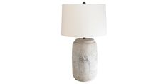 a white table lamp with a black base and a white linen shade on the top