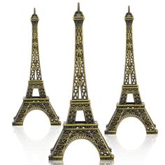 three miniature eiffel tower figurines sitting next to each other