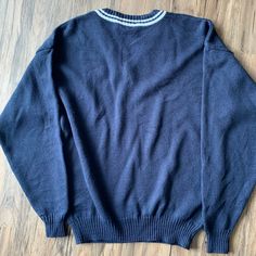 "Iconic Arnold Palmer soft cable knit sweater with drop shoulders and comfortable wide sleeves Ribbed knit V-neck, cuffs and hem. Blue Golf sweater, Umbrella logo and White trim Very nice pre-owned condition, I see no issues. Tag size is men's vintage medium MEASUREMENTS (while lying flat): ✦✦ shoulder to shoulder = 24\" ✦✦ armpit to armpit = 22\", Chest total 44\" ✦✦ shoulder to end of sleeve = 23.5\" ✦✦ length= 26\" #11" Umbrella Logo, Summer Linen Shirt, Golf Sweater, Arnold Palmer, Mens Pullover, Golf Sweaters, Pullover Sweater Men, Golf Clothing, Summer Linen