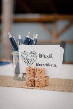 corks are stacked on top of a table with a sign that says mush