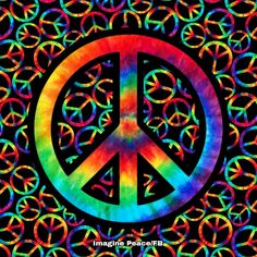 a peace sign painted in rainbow colors on a black background with interlocked circles