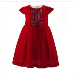 Sumptuous Velvet Dress In Rich Red Trimmed With Tartan Ribbon. A Luxurious Party Dress With A Pleated Skirt, Cap Sleeves And Double Layer Velvet And Tartan Bows On The Bodice. Fully Lined With A Concealed Zip Closure At The Back, And Netting Under Skirt. 80% Rayon, 20% Nylon (Soft Velvet) Lining: 100% Lightweight Cotton Dry Clean Size 6 Months, 18 Months, 24 Months And 2t Retail $155 (40) Luxurious Party, Tartan Ribbon, Silk Velvet Dress, Rachel Riley, Bow Dress, Red Tartan, Girls Bows, Red Silk