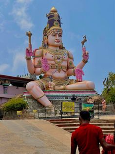 there is a large statue in front of the building