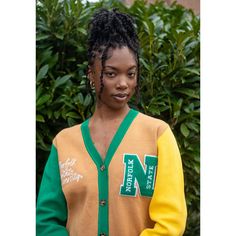 Make a bold statement and wear your Norfolk State pride with this one-of-a-kind and comfortable cardigan sweater, perfect for any alumni, students or supporters. Made with the highest quality materials, this sweater is designed to keep you warm and cozy while representing NSU. Features:- Official Norfolk State University logo embroidered on the chest- Large "N" Chenille patch- Classic cardigan design with a tortoise shell button-up front- Two front pockets (deep enough to fit a phone and other e Collegiate Cardigan For College In Fall, Collegiate Fall Cardigan For College, Fall Collegiate Style College Cardigan, Collegiate Style Cardigan For Fall College Season, Collegiate Style Fall Cardigan For College, Collegiate Long Sleeve Cardigan For College, Long Sleeve Collegiate Cardigan For College, Casual Cardigan With Ribbed Cuffs For College, Varsity Sweater For College In Fall