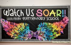 a colorful bulletin board with the words watch us soar elementary school