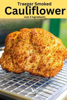 a close up of some food on a metal rack with the words, traeger smoked cauliflower just 3 ingredients