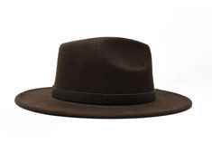 "The Isaac Hat from the Tulum Collection Type: Center Dent Wide Brim Fedora Specifications: Adjustable Size- With a tie of a knot, adjust the fit of your hat to the ideal size from 21 ¼ to 23 ¼ inches. Dimensions: Wired Brim: 2 7/8\", Crown: 4\" Color: Brown Materials: 65% Cotton , 35% Polyester Genuine Leather Band Quilted Bow Origin: All of our hats begin in Ecuador as the body is molded, then completed in Tucson, AZ where they are shaped, trimmed and given their destiny with artisanal hatband Adjustable Brown Fedora With Flat Bill, Adjustable Flat Brim Fedora, Brown Fedora, Womens Fedora, Wide Brim Fedora, Carnelian Stone, Hat Box, Tucson Az, Pop Up Shops