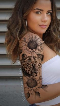 a woman with a sunflower and leopard tattoo on her arm