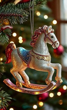 an ornament shaped like a rocking horse hanging from a christmas tree