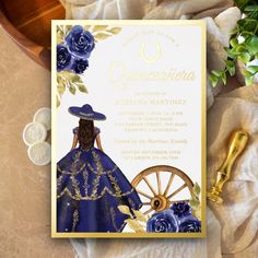 a blue and gold quinceaueria themed birthday party with flowers on the table