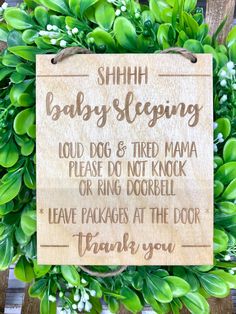 a wooden sign that says, shih baby sleeping loud dog and tired mama please do not knock or ring door bell leave packages at the door thank you