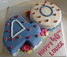 two decorated cakes sitting on top of a table