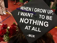 a graduation cap with the words when i grow up, i want to be nothing at all