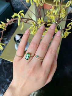 This wonderfully delicate Emerald infinity band is set in 18K yellow gold. These emeralds are perfectly suited for stacking.  Each hand-selected gemstone has been meticulously bezel set by our master goldsmith.  These gorgeous emeralds have been ethically sourced from the world's first class gemstone company Gemfields. Dainty Emerald Cut Bezel Set Rings, Elegant Green Emerald Cut Stackable Rings, Green Bezel Setting Stackable Rings, Emerald Cut Birthstone Stackable Rings Fine Jewelry, Fine Jewelry Green Stackable Jewelry, Elegant Green Stackable Rings With Bezel Setting, Formal Emerald Gemstone Stackable Rings, Classic Green Emerald Cut Stackable Rings, Classic Green Emerald-cut Stackable Rings