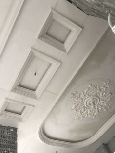 the ceiling is covered in white plaster