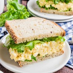 an egg salad sandwich on a plate with lettuce