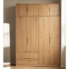 a large wooden cabinet with drawers in a room