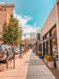 a city street with cars parked on both sides