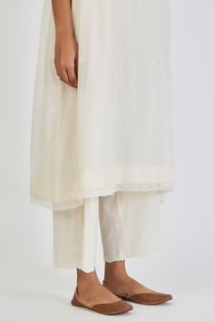 Ivory three fourth sleeves straight kurta in chanderi base with light gathers, all over buttis and ditsy fleur embroidery on the cut work detail neckline. Paired with a palazzo. - Aza Fashions Elegant Off White Kurta For Spring, Elegant Cream Kurta For Summer, Off White Kurta For Summer Wedding, Elegant White Kurta For Summer, Elegant White Kurta For Spring, Formal White Kurta For Spring, Elegant White Spring Kurta, Kurta With Palazzo, Straight Kurta