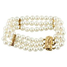 Gorgeous Pearl Bracelet  Features Three Rows of Round Pearls Pearls Appx 5 - 6 mm in Diameter Nice Whitish, Pinkish, Mauvey Pearlescence 78 Pearls Total Three 14k Yellow Gold Bar-Shaped Accents 14k Yellow Gold Clasp Total Length = 7" Total Mass = 33.10 grams Beautiful Gift! Elegant Bracelet With Box Clasp For Anniversary, Elegant Anniversary Bracelet With Box Clasp, Elegant Formal Bracelets With Clasp, Elegant Formal Bracelet With Clasp, Elegant Wedding Bracelets With Clasp, Elegant Wedding Bracelet With Clasp, Classic Formal Bracelet With Clasp, Formal Single Strand Beaded Bracelet, Classic Formal Bracelet