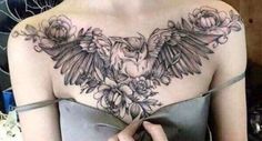 a woman's chest with an owl and flowers on it