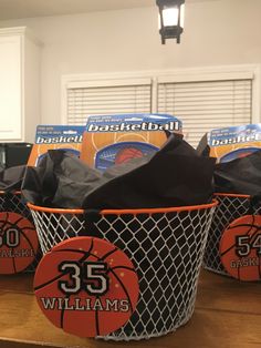 basketball themed birthday party favors in black and orange basket liners with the number 35 on them