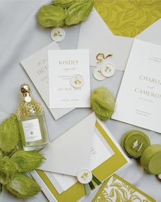 an assortment of wedding stationery items including rings, brochures, and cards