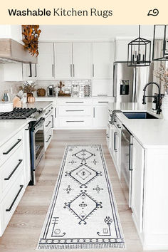 a kitchen with white cabinets and an area rug on the floor