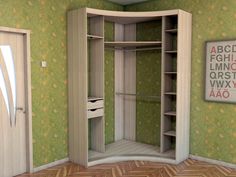 an empty closet in the corner of a room with green wallpaper and wood flooring