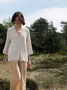 Long cardigan with 3/4 sleeves and V-neck. Knitted in a luxurious and super soft blend of 70% llama wool and 30% silk in a fine pearl knit pattern. Natural colour that is easy to match with all the styles from this season. Knitted by our partners in Bolivia with a strong focus on social sustainability. Social Sustainability, Pearl Cardigan, Pearl Knit, Summer Layering, Summer Layers, Knit Pattern, Knitted Cardigan