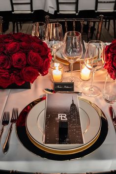 a table set with red roses and place settings for an elegant wedding reception at the rivo in new york city