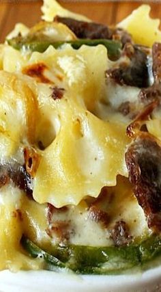 a close up of a plate of food on a table with broccoli and cheese