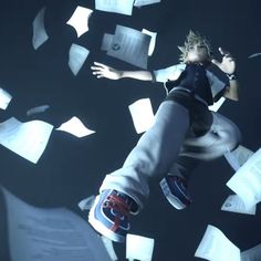 a boy flying through the air surrounded by papers