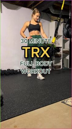 a woman standing in the middle of a room with her arms behind her back and text overlay that reads 30 minute trx full body workout