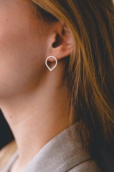 "This beautiful and minimal open teardrop stud earrings are handmade of 925 sterling silver square wire and has been brushed to a matte finish for a finer look. Those simple raindrop earrings are small, elegant and perfect for everyday wear! Measurements: ● Length: 1.5 cm / 0.4\" Width: 1.3 cm / 0.4\" Want to see more jewelry from my shop? click here: http://etsy.me/2uPuv0x Find more earrings here: http://etsy.me/2tW4sYr Find matching rings here: http://etsy.me/2u40p9h ● Item will be shipped bea Modern Teardrop Wrap Earring (single), Modern Teardrop Wrap Earring, Modern Teardrop Single Wrap Earring, Modern Everyday Teardrop Pierced Earrings, Modern Teardrop Earrings For Gift, Minimalist Jewelry With Matching Teardrop Pendant Earrings, Minimalist Teardrop Pierced Wrap Earrings, Silver Teardrop Wrap Earrings, Modern Teardrop Sterling Silver Wrap Earrings