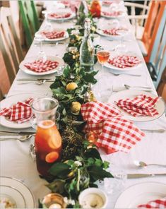 a long table set with plates and silverware