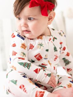 Celebrate the magic of the holiday season with our Family Pajamas. Perfect for creating sweet, lasting memories with your family, these matching pajamas bring a sense of togetherness and festive cheer. Made from our signature ButterSoft fabric, you'll stay cozy and comfortable, whether you're decorating the tree, baking cookies, or enjoying a holiday movie night together. Sizing Model is wearing 6-12M. 0-3M | Chest 17.25", Length 18.75" 3-6M | Chest 19", Length 20.75" 6-12M | Chest 20.5", Length Matching Christmas Pajamas Family Newborn, Toddler Christmas Pjs, Baby First Christmas Pajamas, Newborn Christmas Pajamas, Matching Christmas Pajamas Newborn, Holiday Movie Night, Embellished Sweatshirts, Loungewear Dresses, Id Wallet