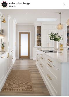 a kitchen with white cabinets and gold handles on the door knobs is featured in an instagram