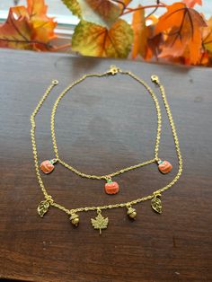 This is a charm necklace with all of the fall vibes. This necklace can be customized to be any length, a bracelet, or an anklet. Simply request that in the "personalization section" and you'll be good to go. If you want to create a custom necklace, please go to my "DIY Charm Necklace" listing HERE: https://bookishgirlsclub.etsy.com/listing/1754325181/diy-bookish-charm-necklace-bookish-merch and we can go from there! PLEASE NOTE: Due to the variability of the packs of charms, you might receive a slight variation to those charms shown. It will be comparable and won't affect the necklace design as a whole. Shipping Details * All of my pieces are handmade and made to order * Please be advised that expedited shipping speeds up transit times only and does not speed up our processing times found Fall Aesthetic Outfit, Pumpkin Necklace, Autumn Jewelry, Bookish Merch, Boo Basket, Diy Charm, Halloween Necklace, Halloween Charms, Necklace Design